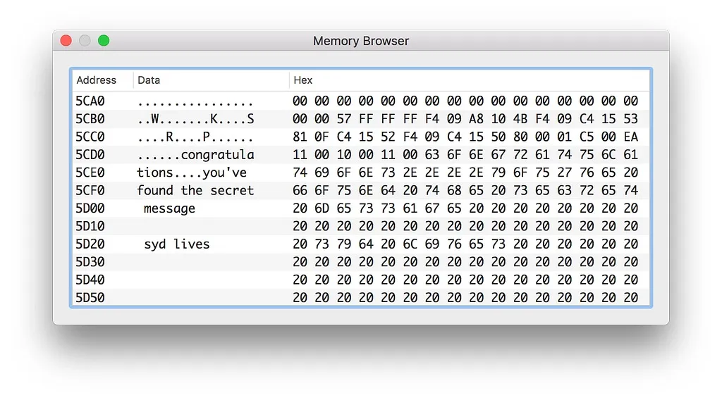 Memory Browser window of the emulator showing the hidden text: congratulations, you've found the secret message, syd lives