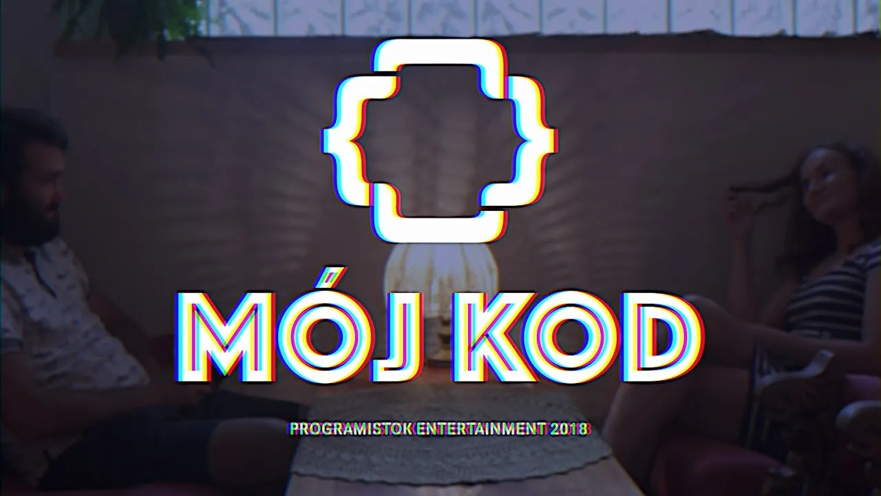The words “MÓJ KOD” under Programistok's curly-brace logo, over a dimmed scene of two people at a table
